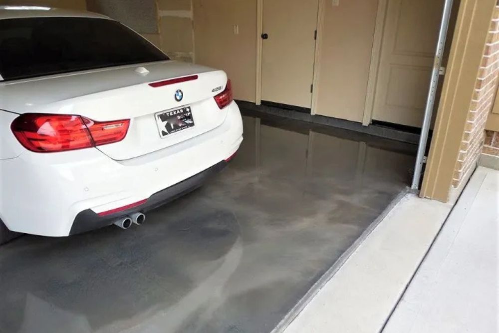 a white car parked on a residential garage