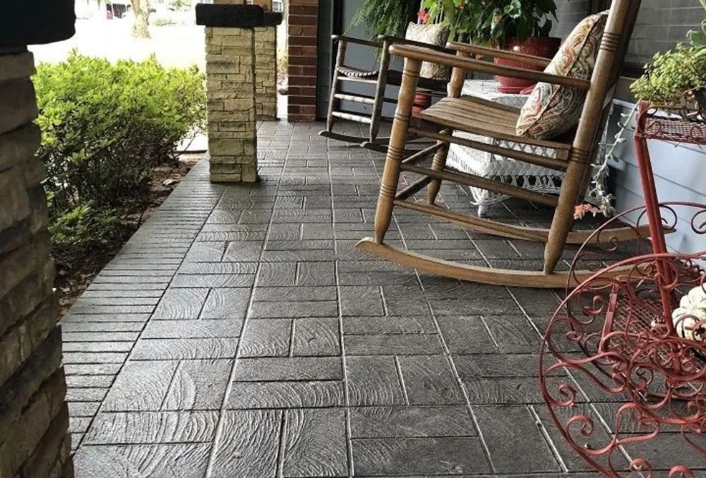 a rocking chair on a stamped overlay patio